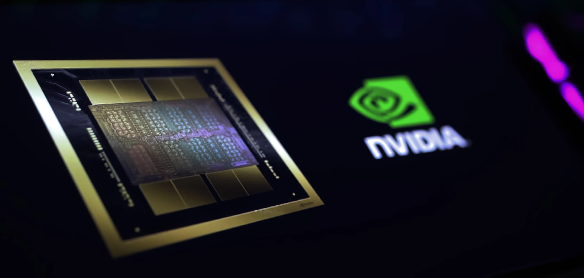 Close-up of an NVIDIA graphics chip alongside the NVIDIA logo.